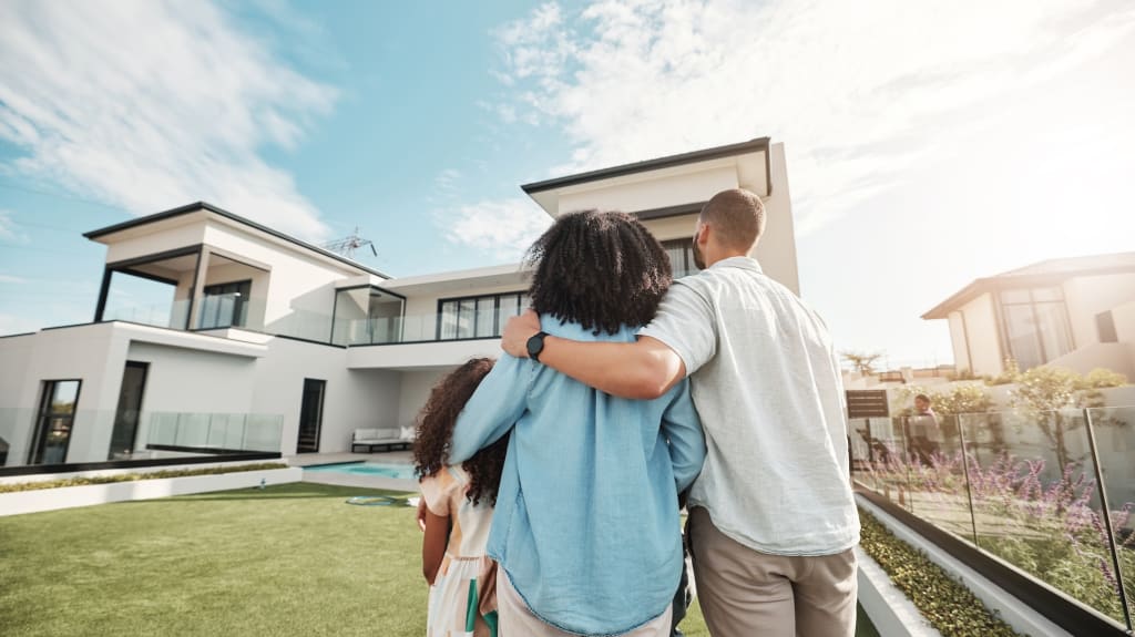 Family in front of a house
