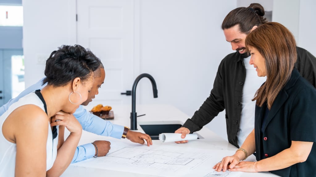 Contractor meeting customers for a renovation project